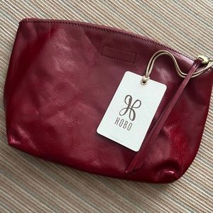 100% genuine leather makeup bag/clutch/wristlet. Brand new with tags.